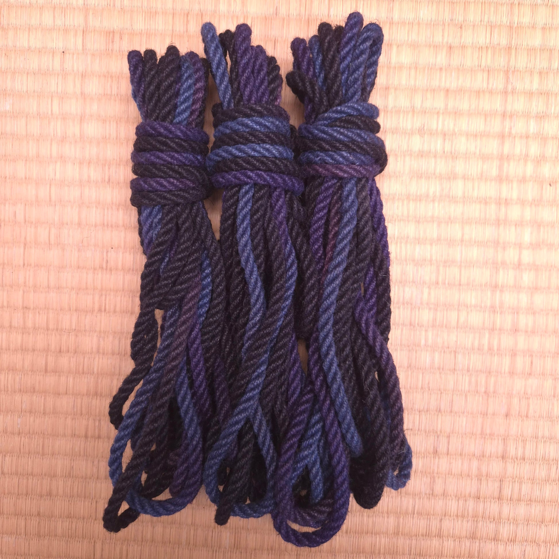 Blue Black rope bundled in a knot on a tatami Floor