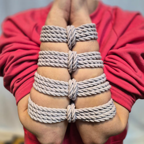 Person wearing Hemp rope bracelets on a blurred background