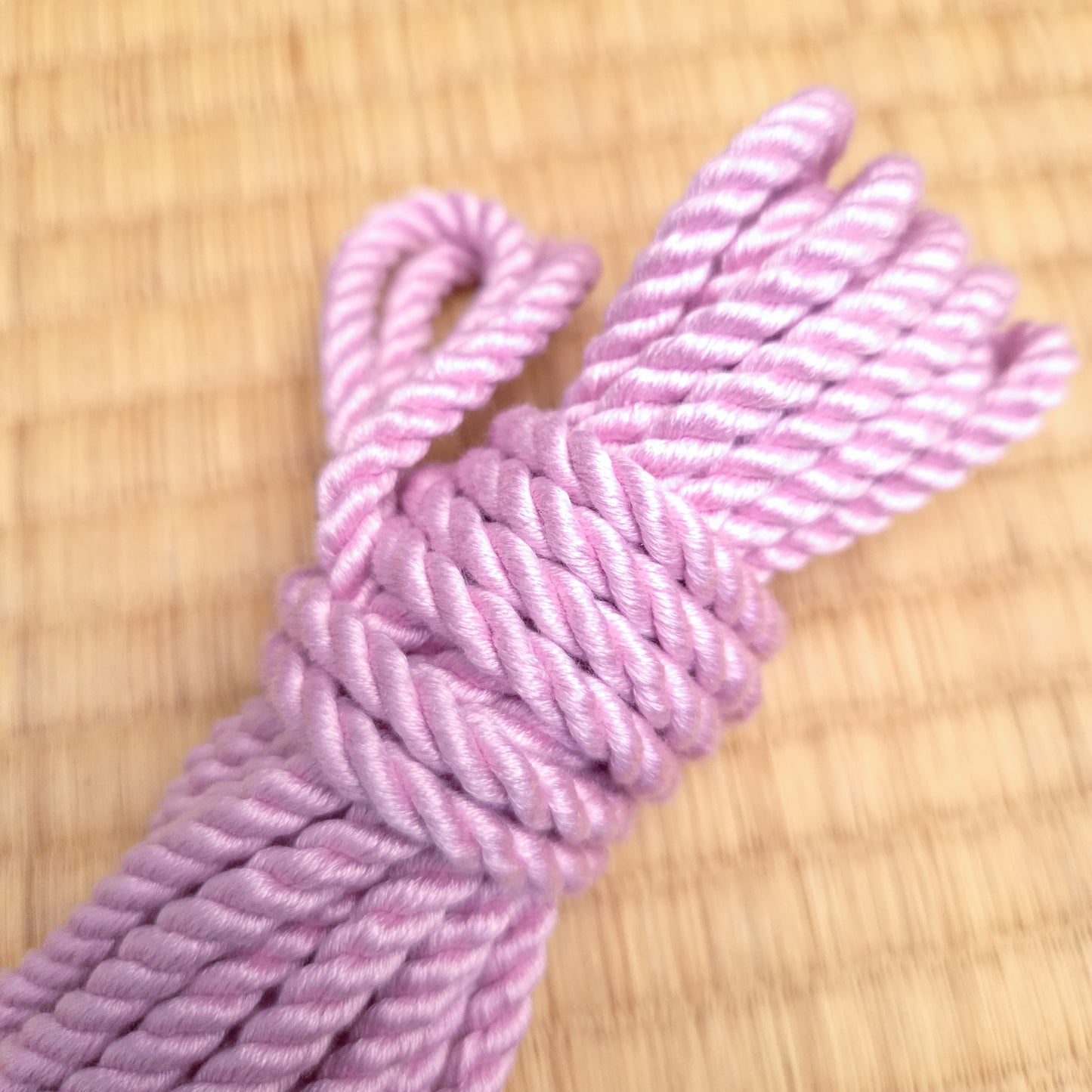 pink shibari rope silk close up
