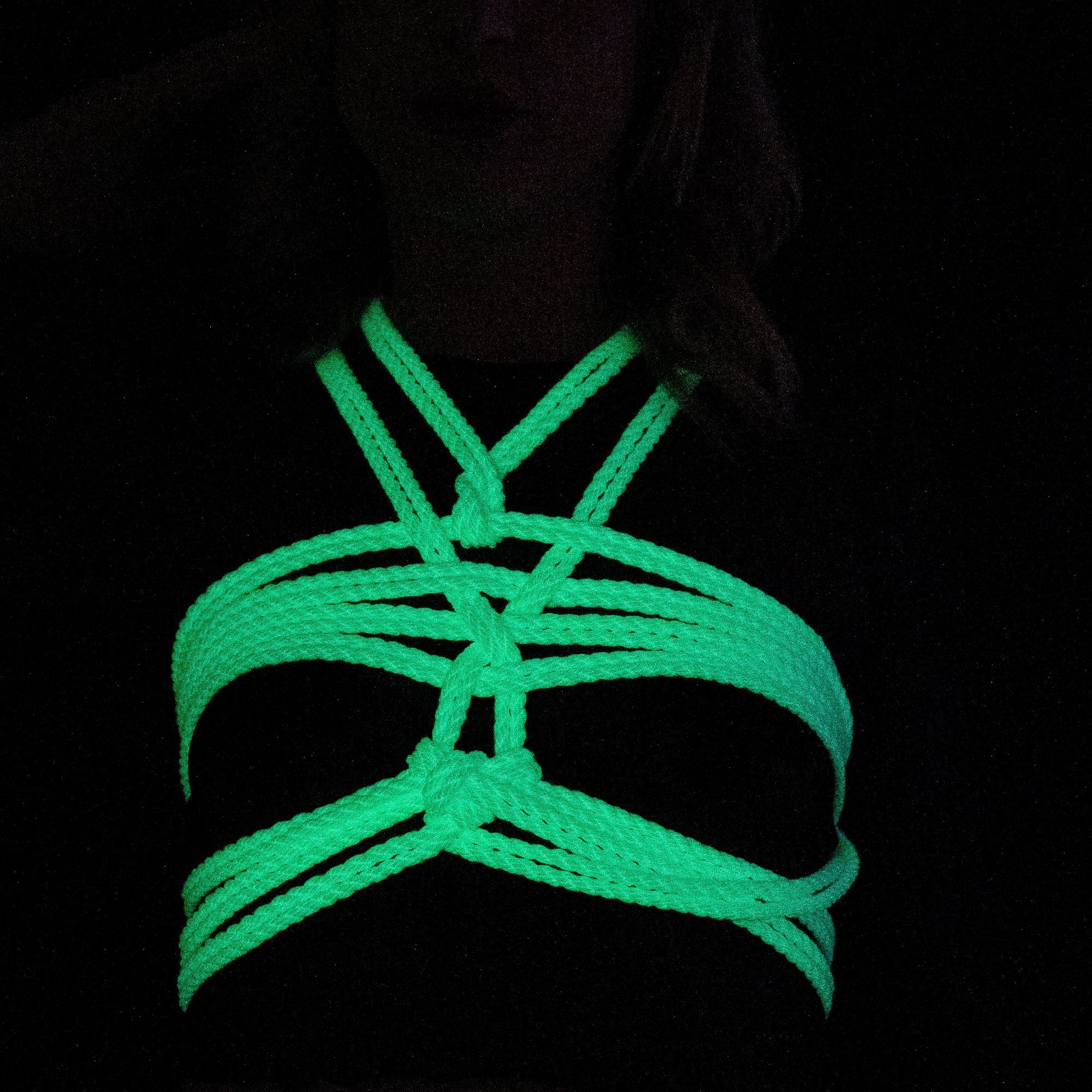 Shibari photography, lilac glow in the dark bondage rope worn on a female model : reborn ropes