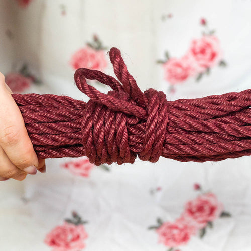 Final picture of a hanked shibari rope in red
