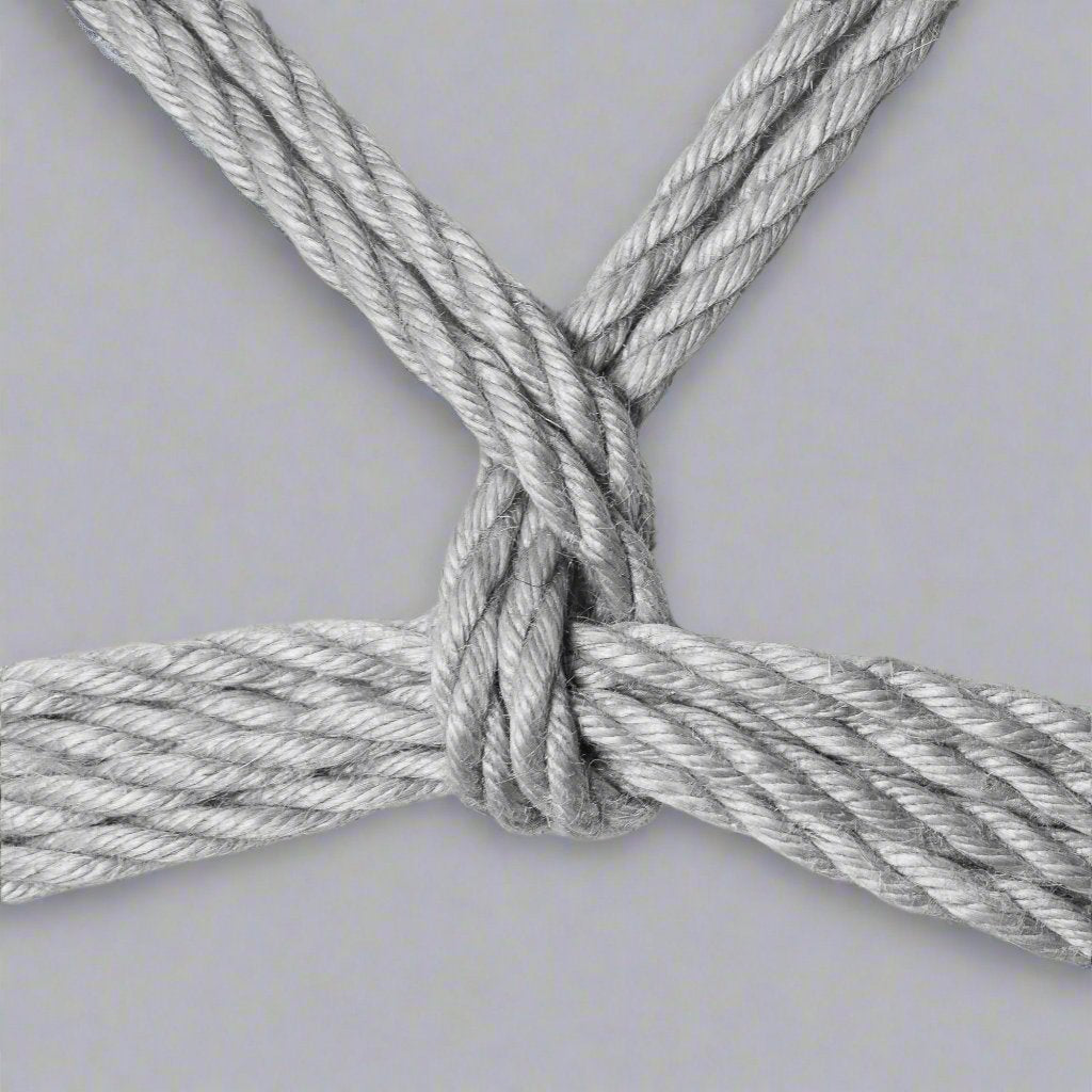 Guide to tieing the shibari knot- Tear Drop- tied on a plain background with jute rope. Reborn Ropes